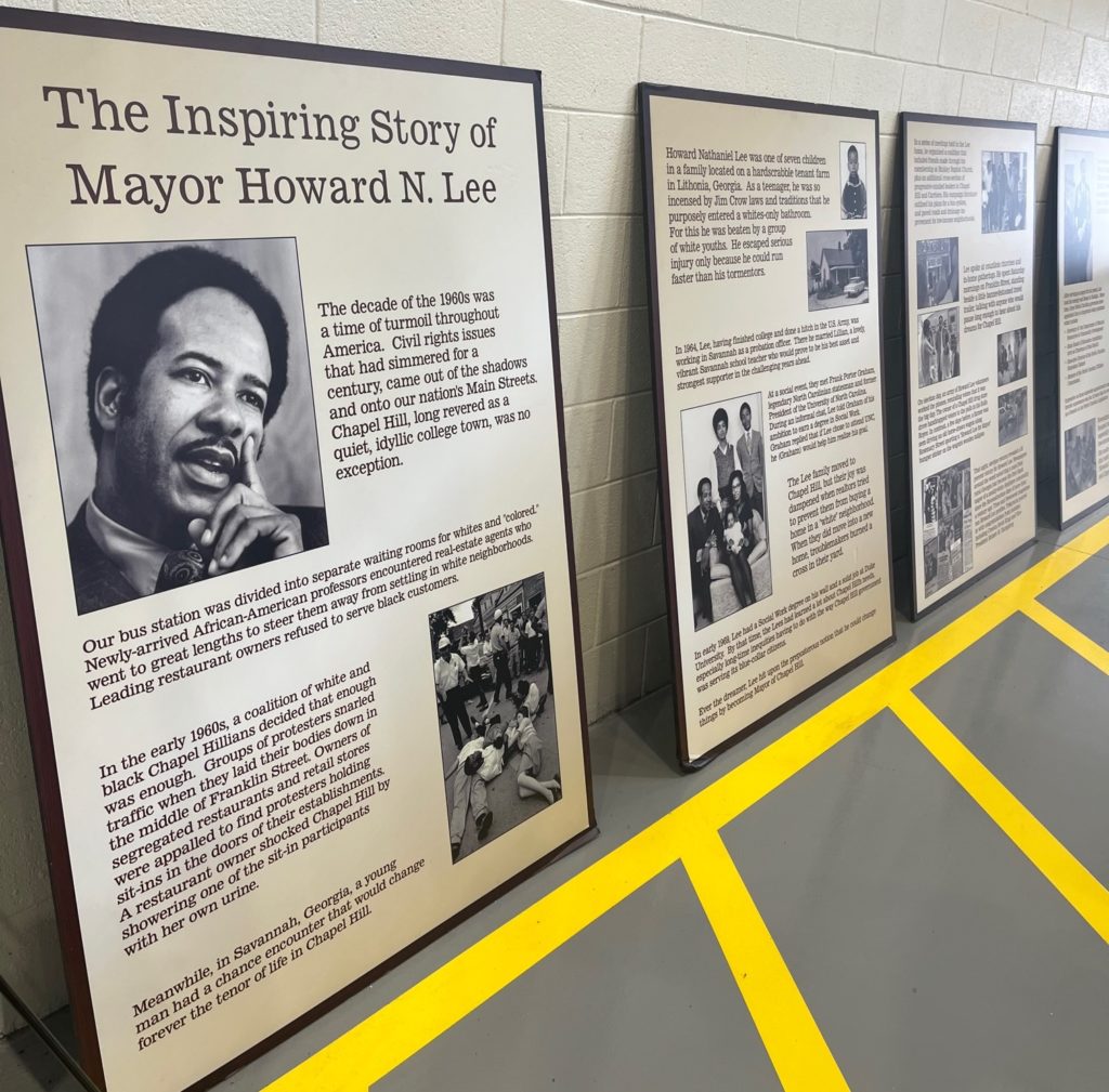 A series of four boards with "The Inspiring Story of Mayor Howard N. Lee"