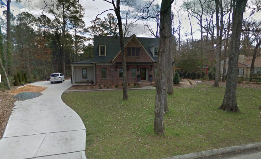 Photo of a house on a wooded lot