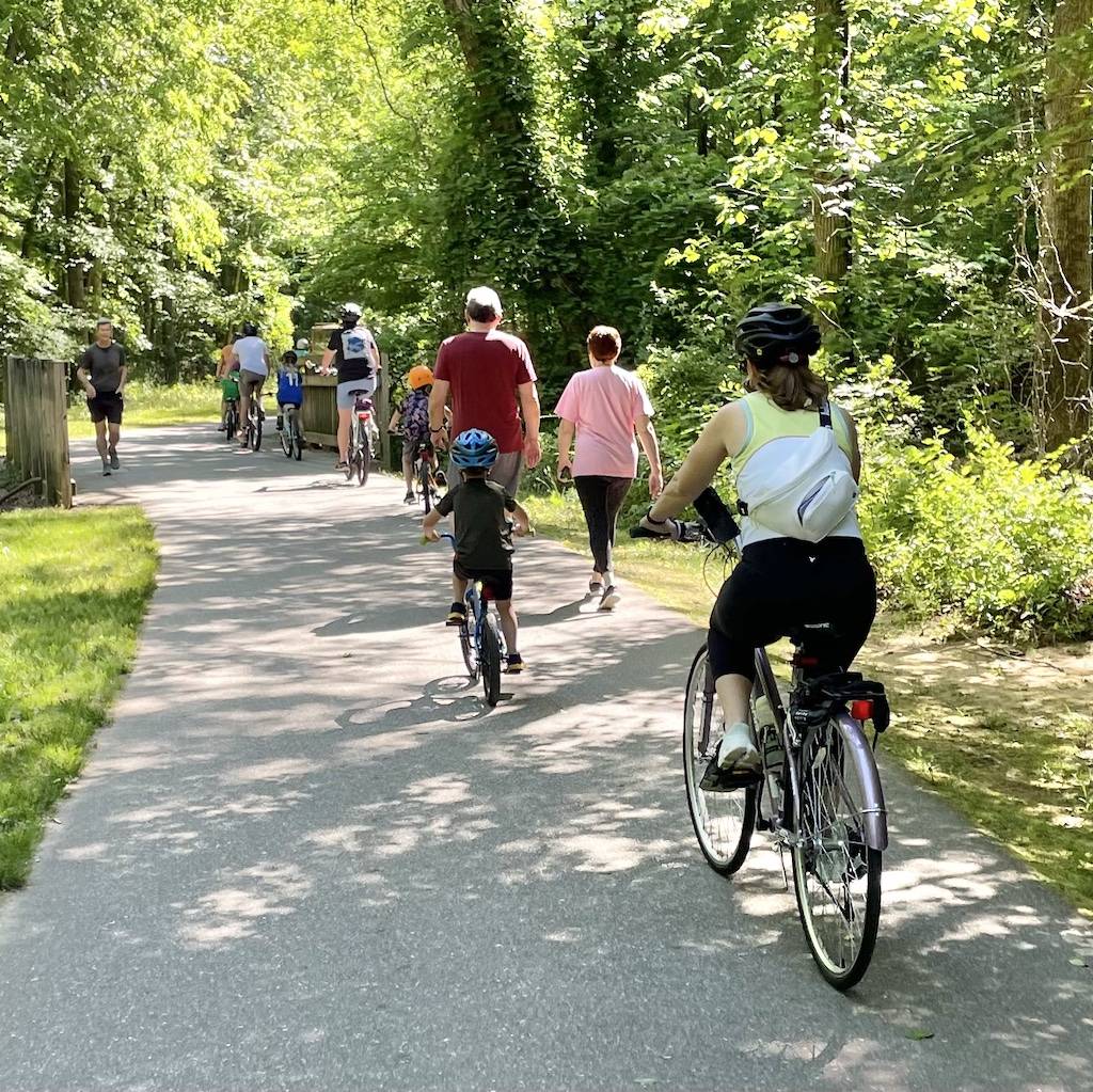 families riding on the chapel hill portion of the bolin creek greenway