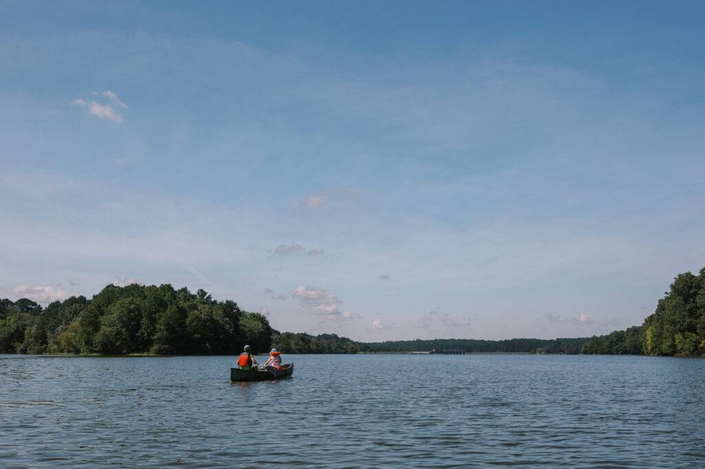 A family canoeing the Cane Creek Reservoir