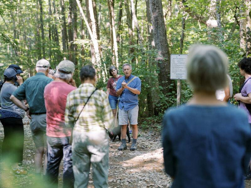Johnny Randall speaks to the attendees of the Bolin Creek walk