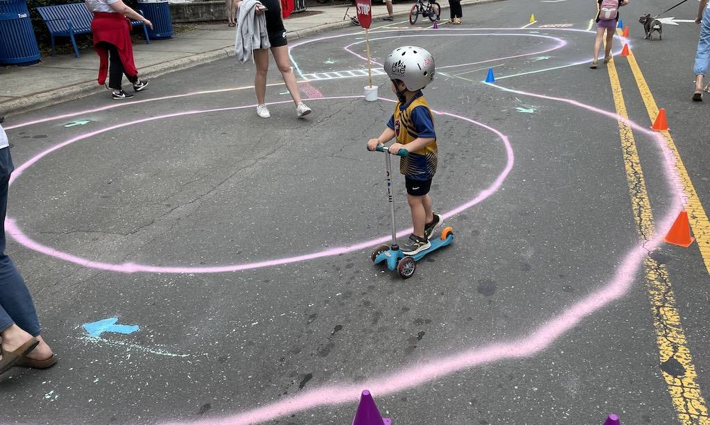 A child using a traffic garden at Carrboro Open Streets