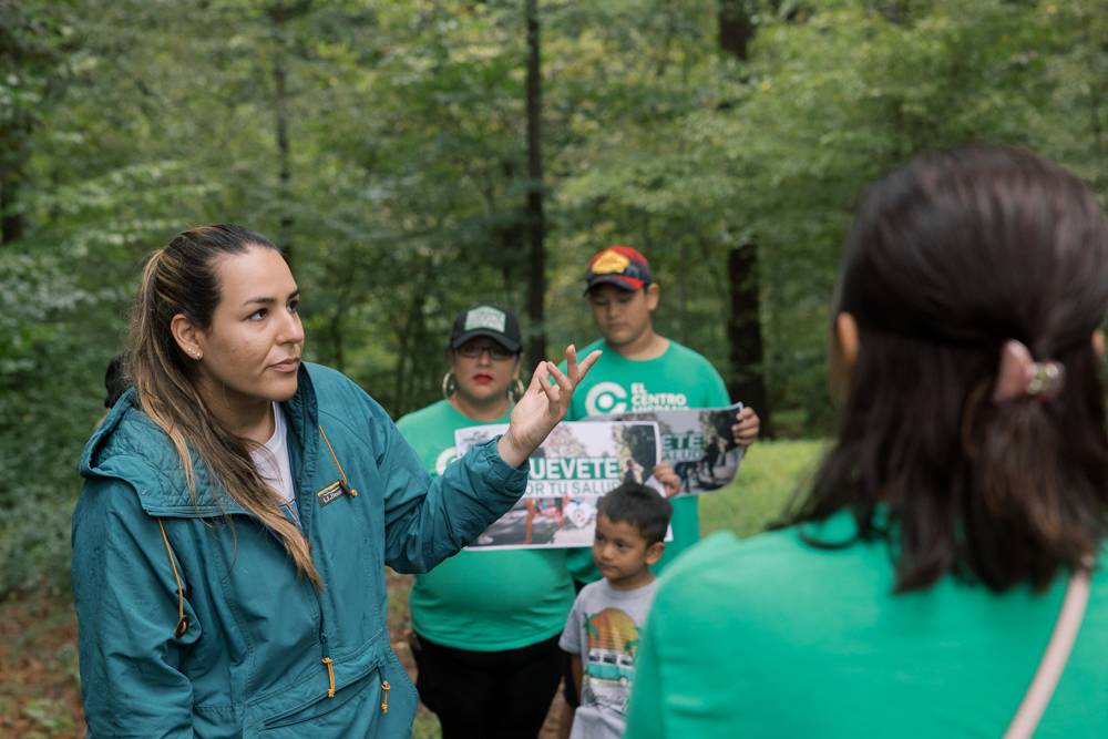 PhD student Ximena Perez-Velasco translates information for native Spanish speakers on the walk