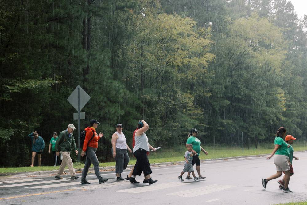 Greenway walk participants get back just before a downpour