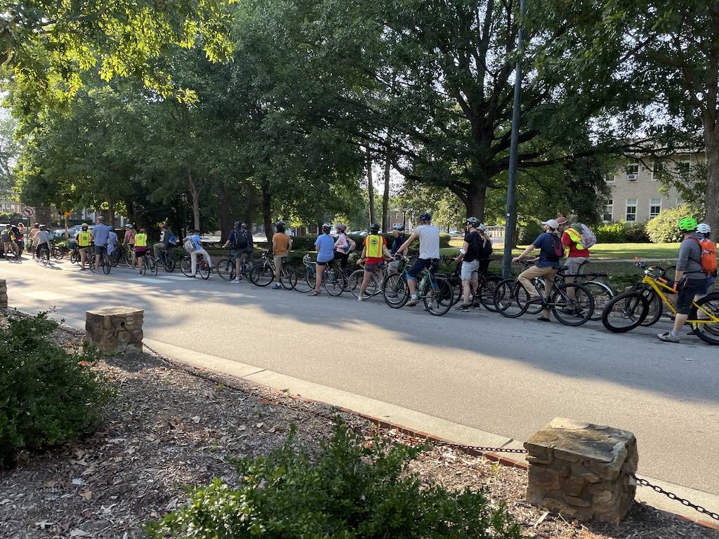 Cyclists lined up on Cameron Ave, waiting for the light to change 