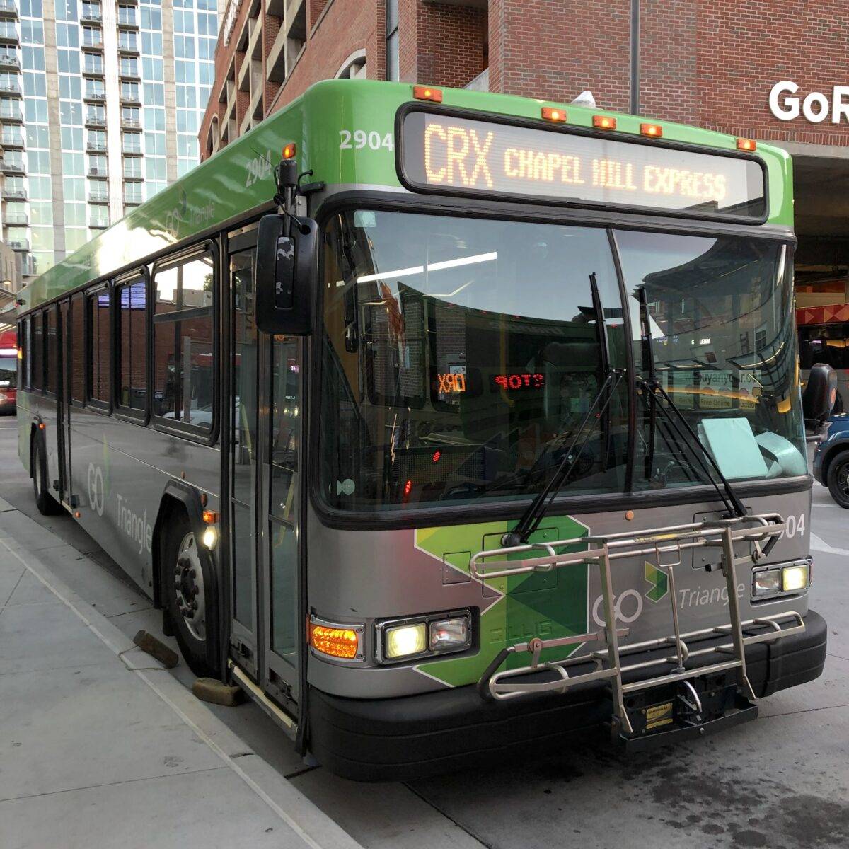 Photograph of the front of a GoTriangle bus with the destination sign reading "CRX Chapel Hill Express"