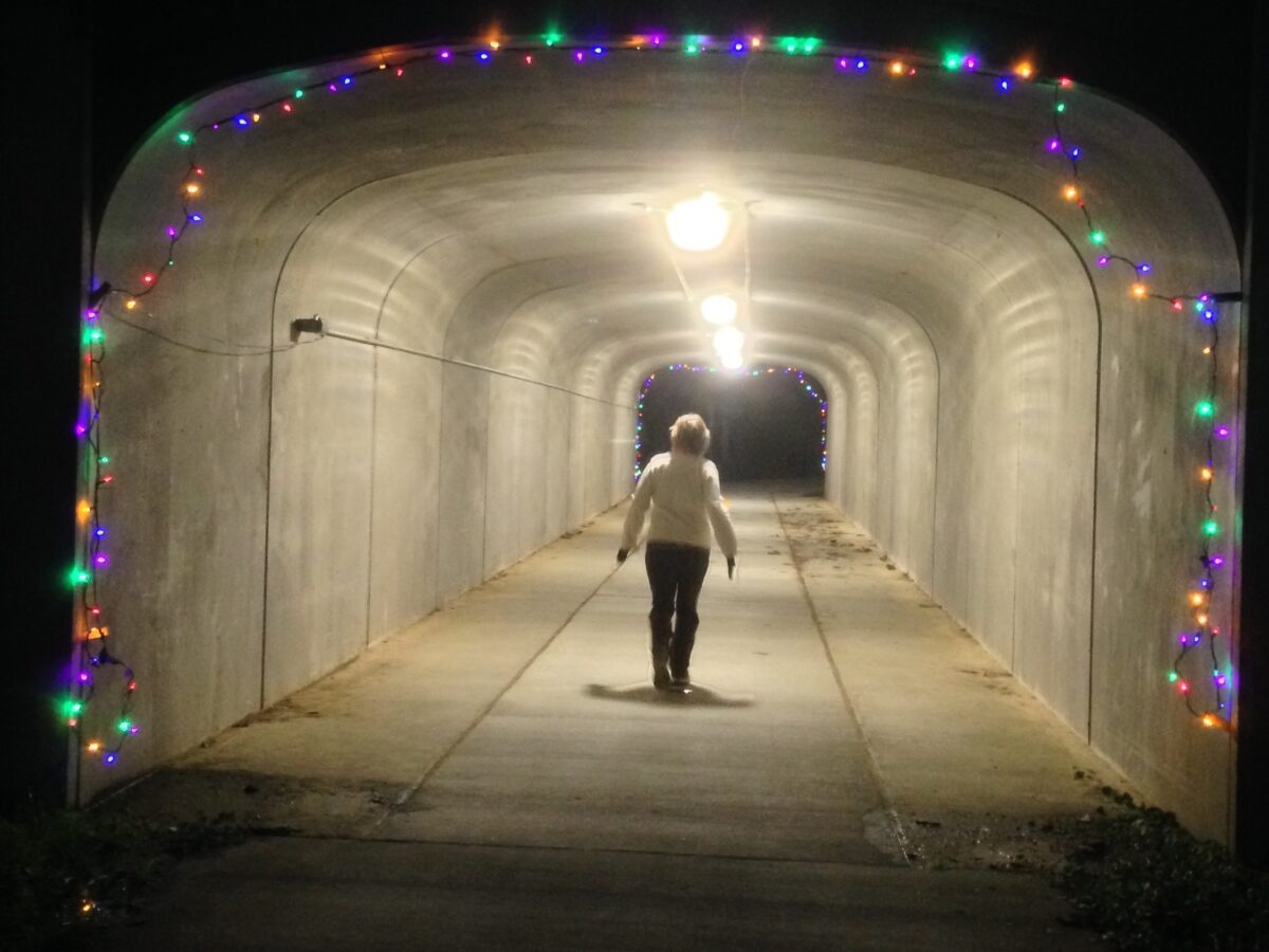 A woman walks through the Culbreth tunnel