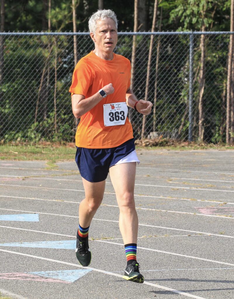 A photo of a man running in a race
