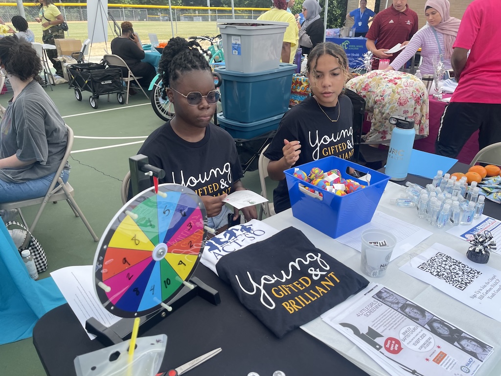 Youth tabling at an. event at the Hargraves Center in Northside
