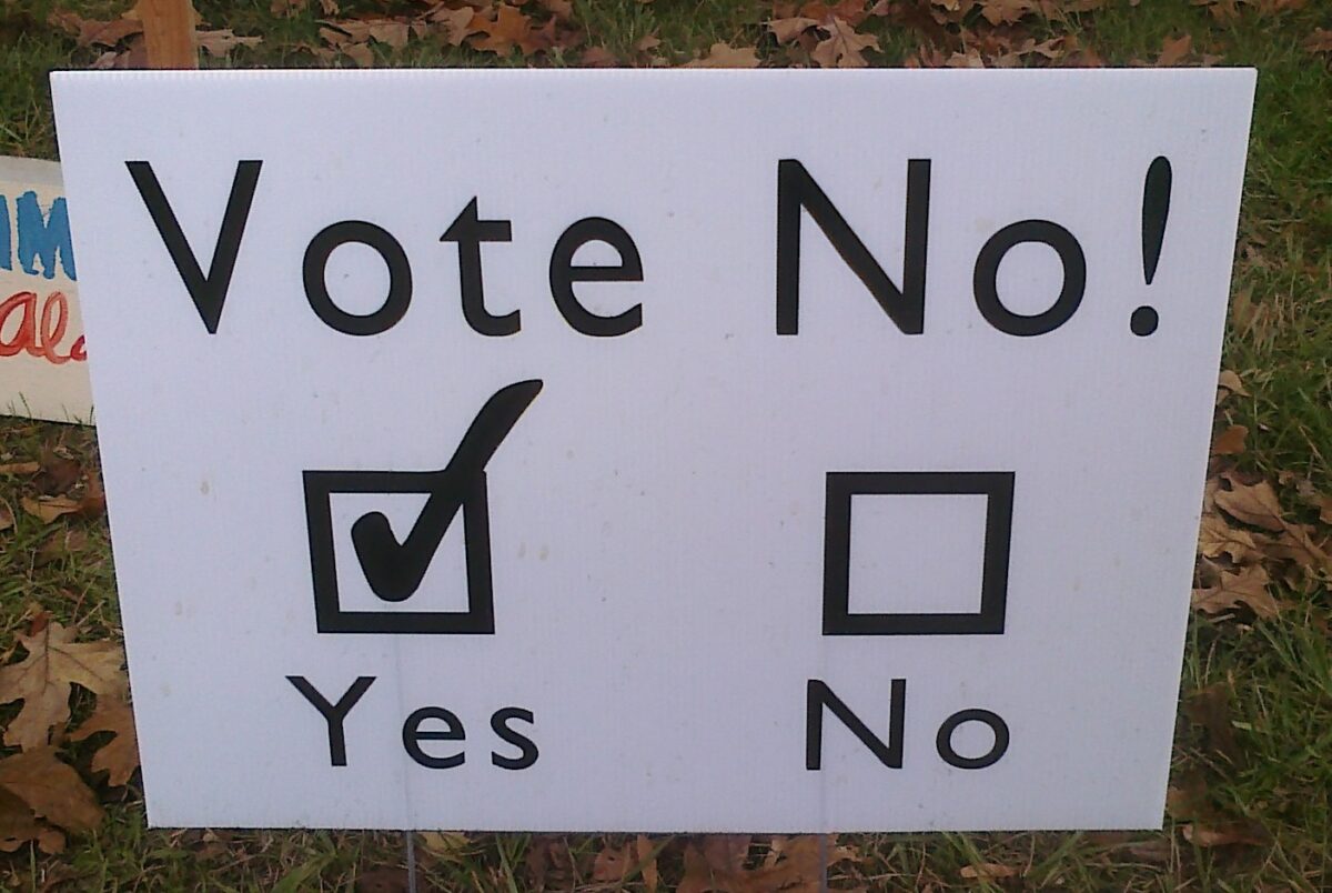A ambiguous sign that suggest voting no, but has the yes box checked