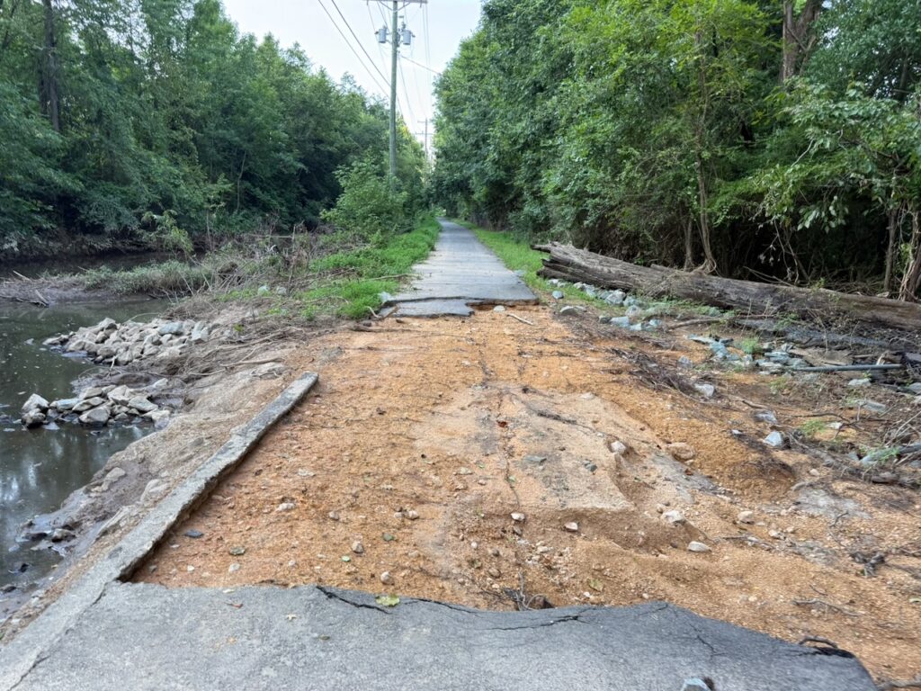 Photo of damage along the Fordham Boulevard greenway in Chapel Hill, showing greenway segment that is torn up