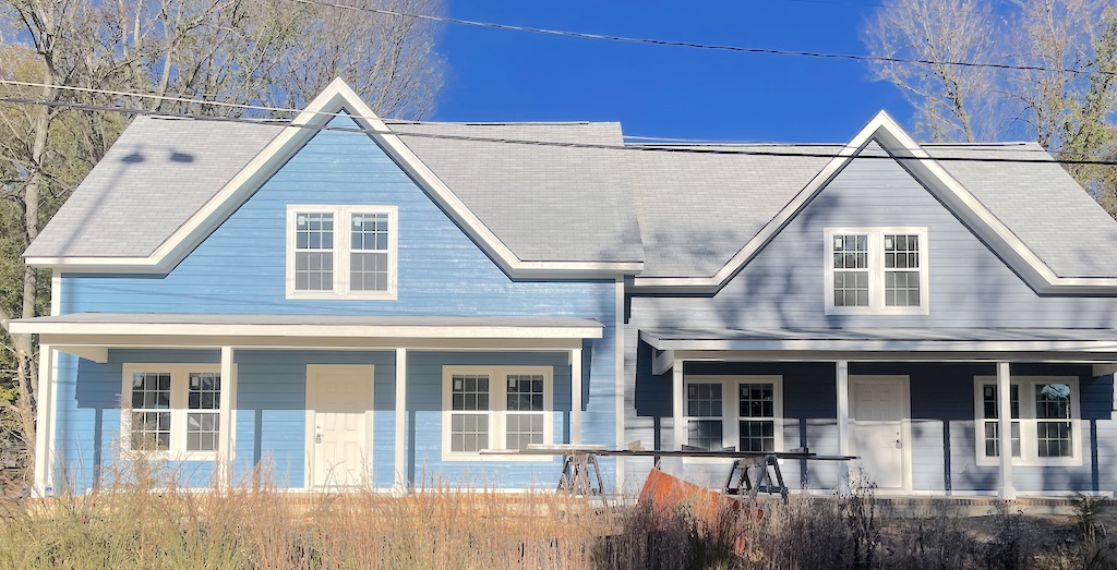 A duplex looms menacingly over the neighbors in the North Side Neighborhood