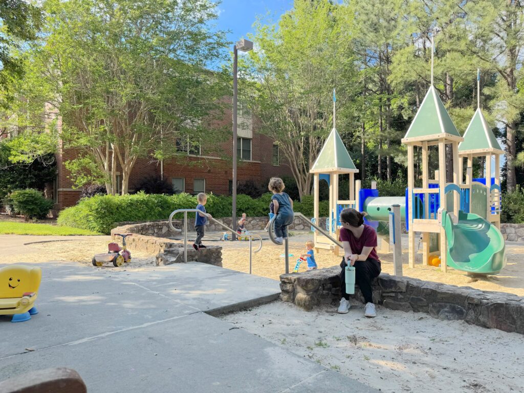 Children play on the playground outside Baity Baity Hill